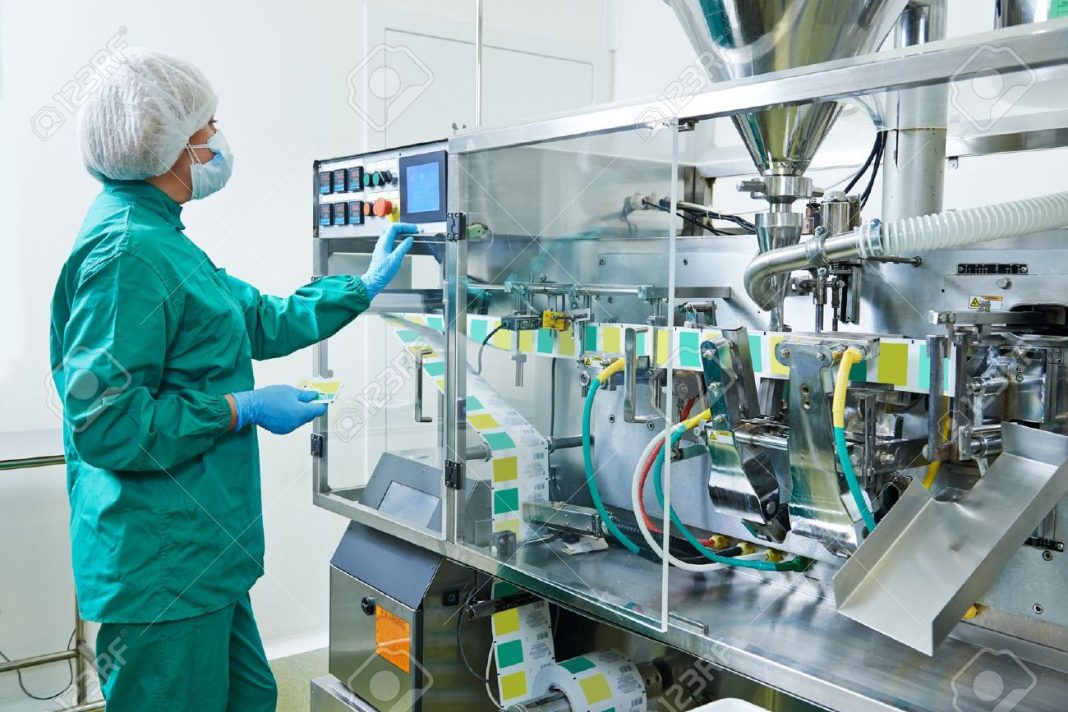 36816443 Pharmaceutical Factory Woman Worker Operating Production Line At Pharmacy Industry Manufacture Facto Stock Photo
